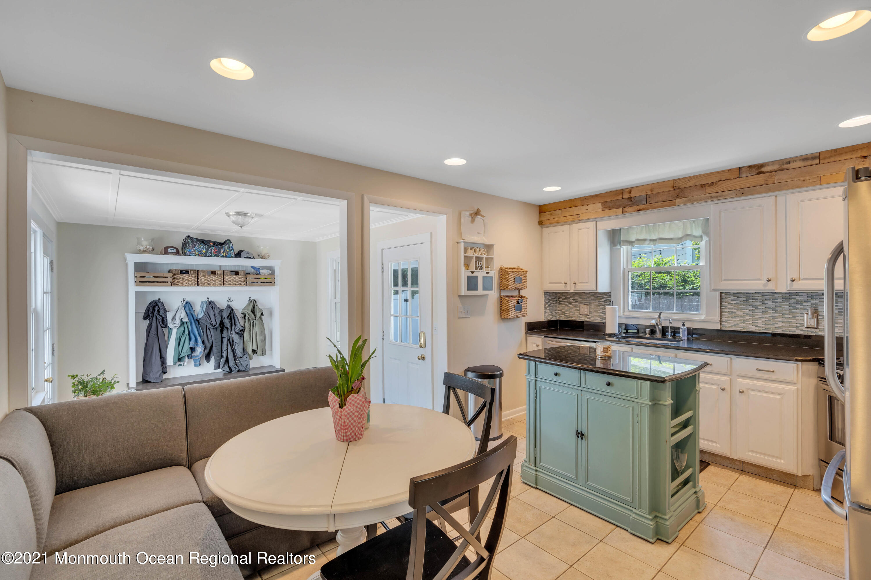 2212 Kenneth Road Point Pleasant, NJ 08742 - Photo 10 of 43 a kitchen with a table chairs sink and cabinets