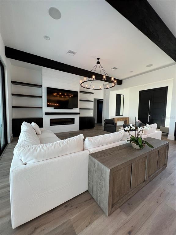 17710 Broad Street Montverde, FL 34756 - Photo 30 of 34 a living room with furniture and a flat screen tv