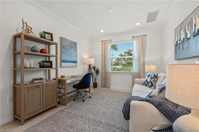 a workspace with furniture and window