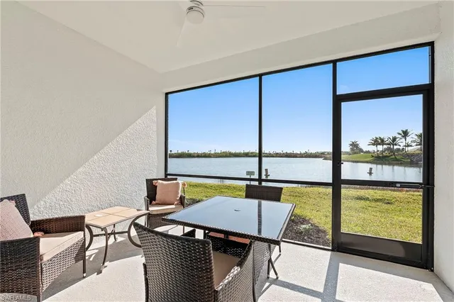 a view of a dining room with furniture from a window