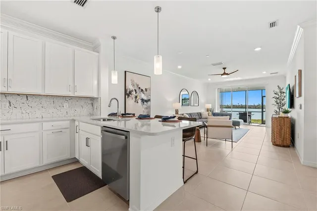 a kitchen with a sink a counter top space and appliances