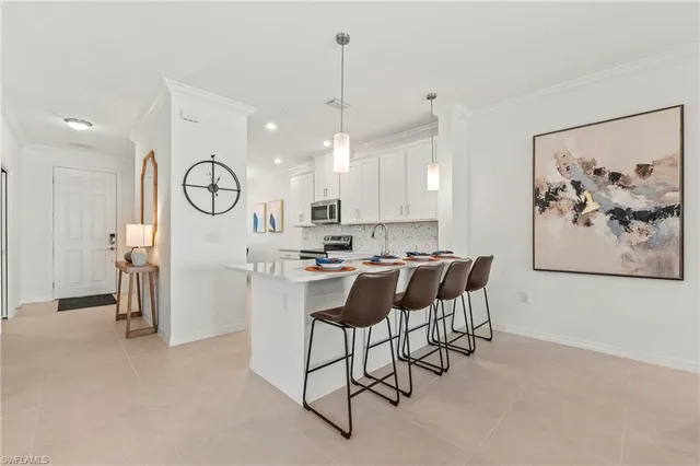 a view of a kitchen with furniture and a window