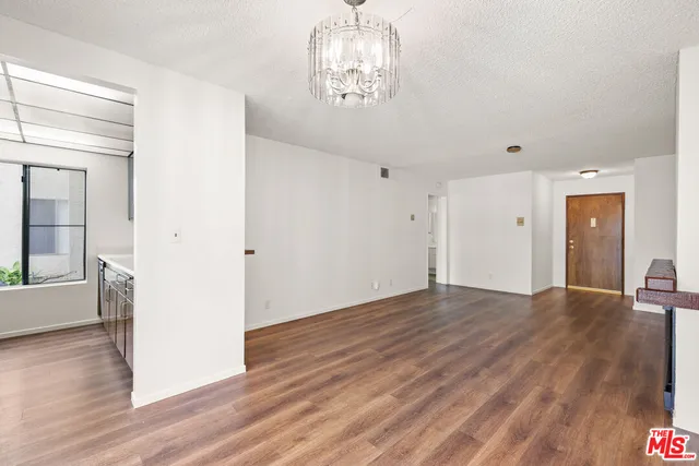a view of a livingroom with wooden floor
