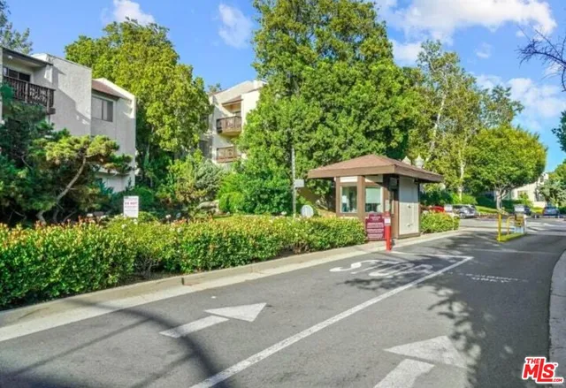 a table and chairs under an umbrella