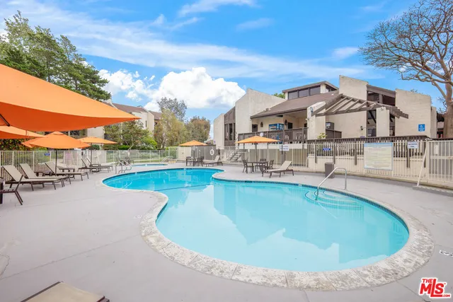 a view of a swimming pool with a patio