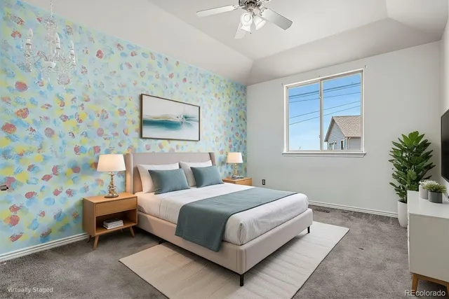 a bedroom with a bed and flat screen tv