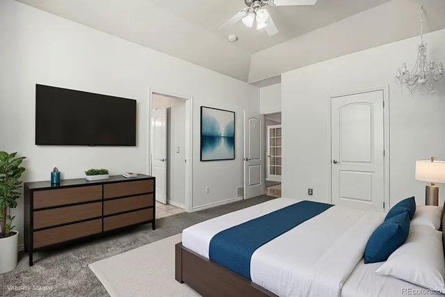 a kitchen with stainless steel appliances granite countertop wooden cabinets a refrigerator a stove a sink and dishwasher with wooden floor