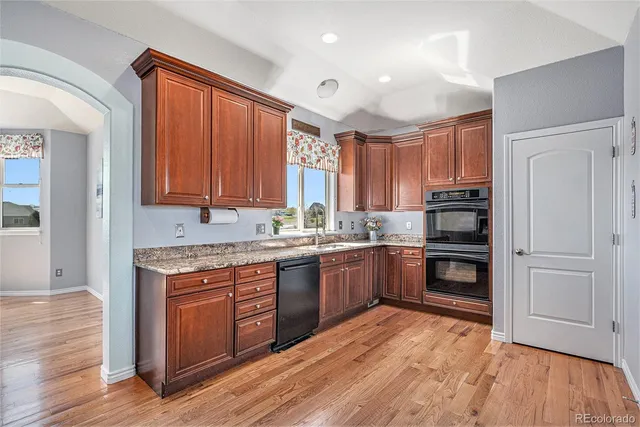 a bathroom with a toilet a sink and a mirror
