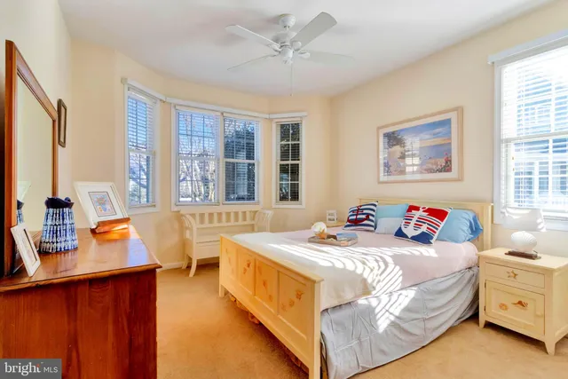 a bedroom with a bed and a table