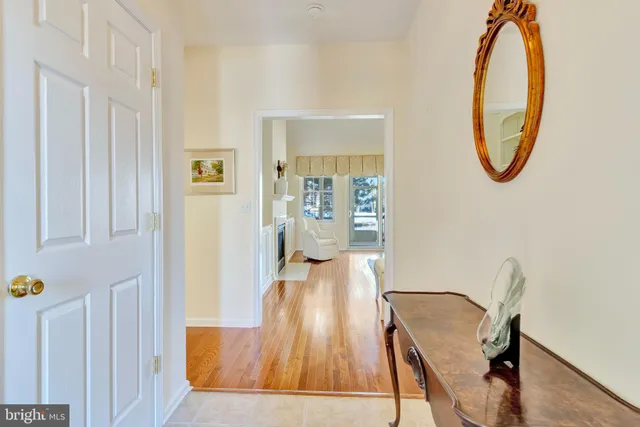 a view of a dining room with furniture and a chandelier