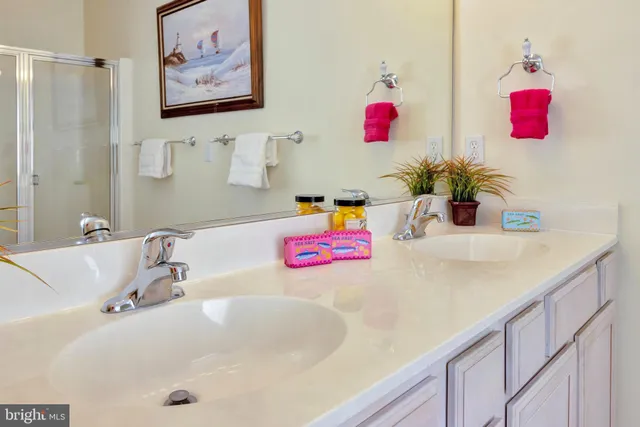 a bathroom with a tub sink and mirror