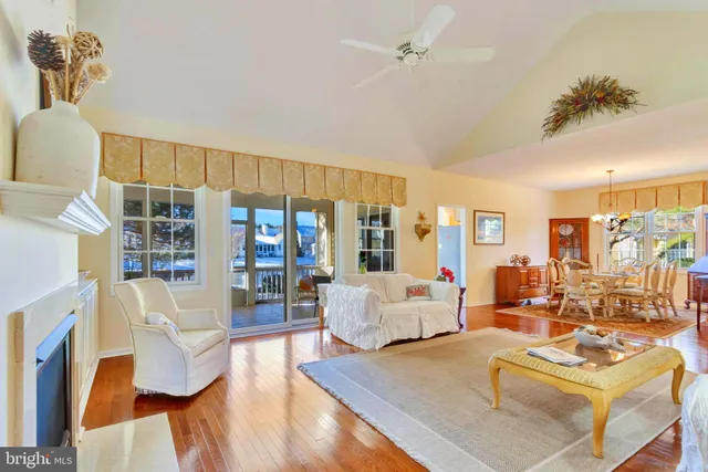 a living room with furniture and a book shelf