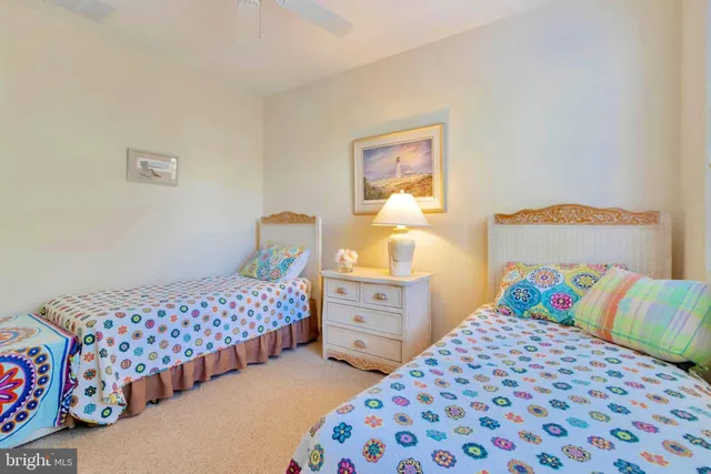 a bathroom with a sink vanity mirror and toilet
