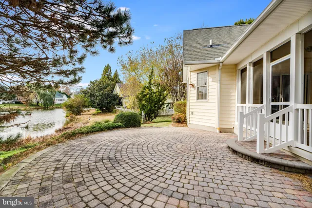a view of a house with a yard and garage