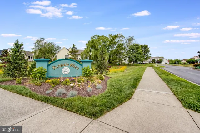 a kitchen with a cabinets and chandelier