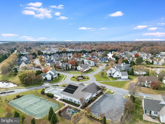 a living room with fireplace furniture and a wooden floor