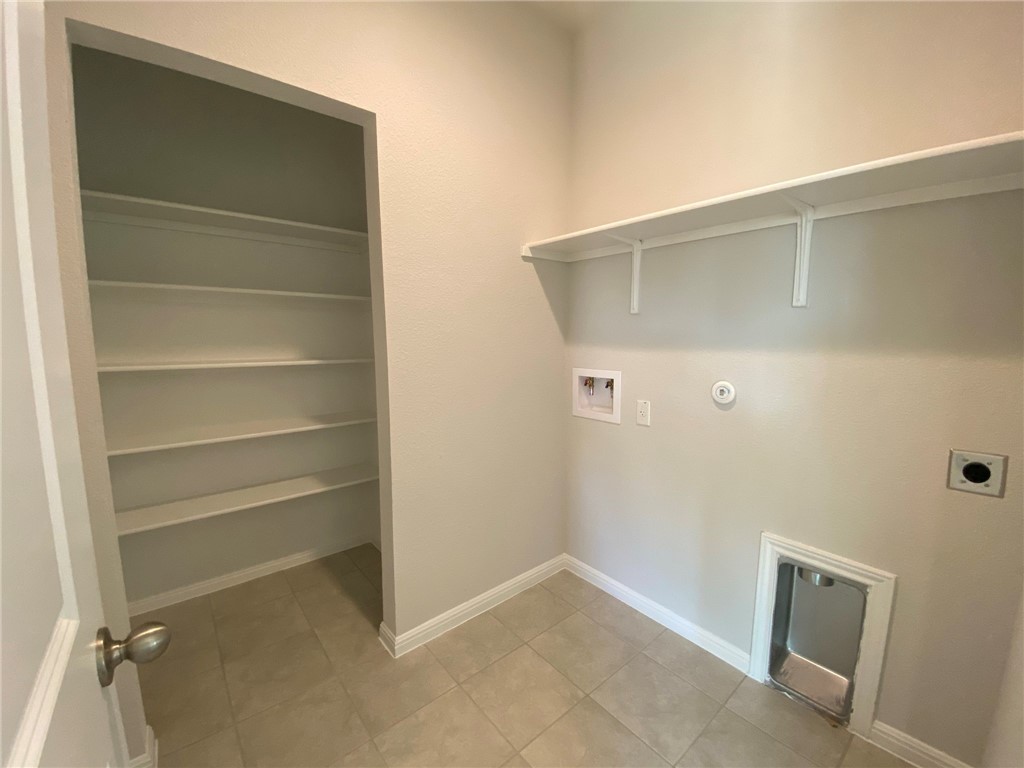 384 Gaida Loop Georgetown, TX 78628 - Photo 15 of 20 Utility closet boast enough space for full size washer and dryer as well as additional storage.