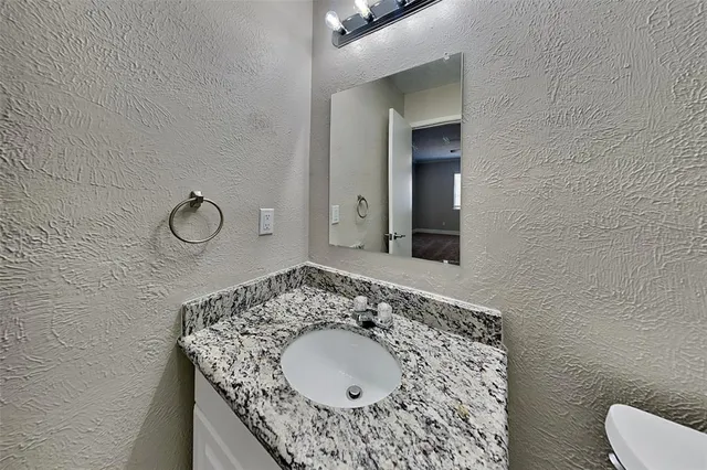 a bathroom with a shower and toilet