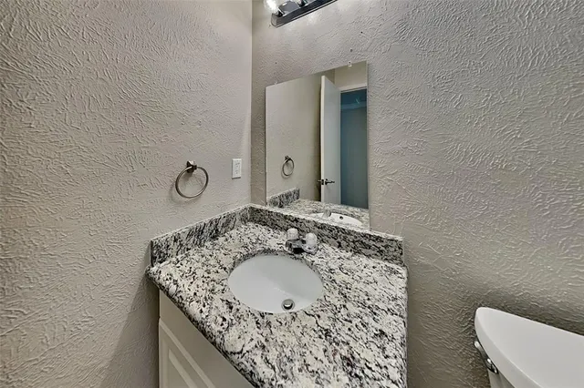 a bathroom with a toilet and bathtub