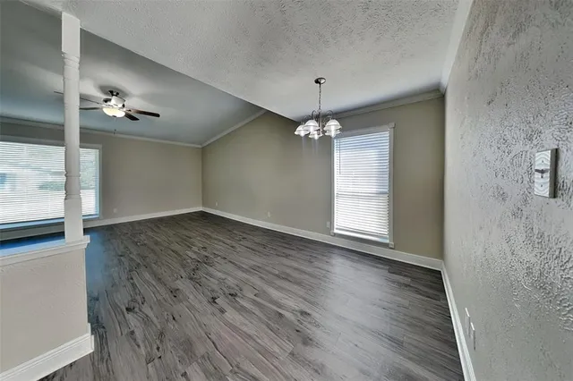 a bathroom with a granite countertop sink a toilet and mirror