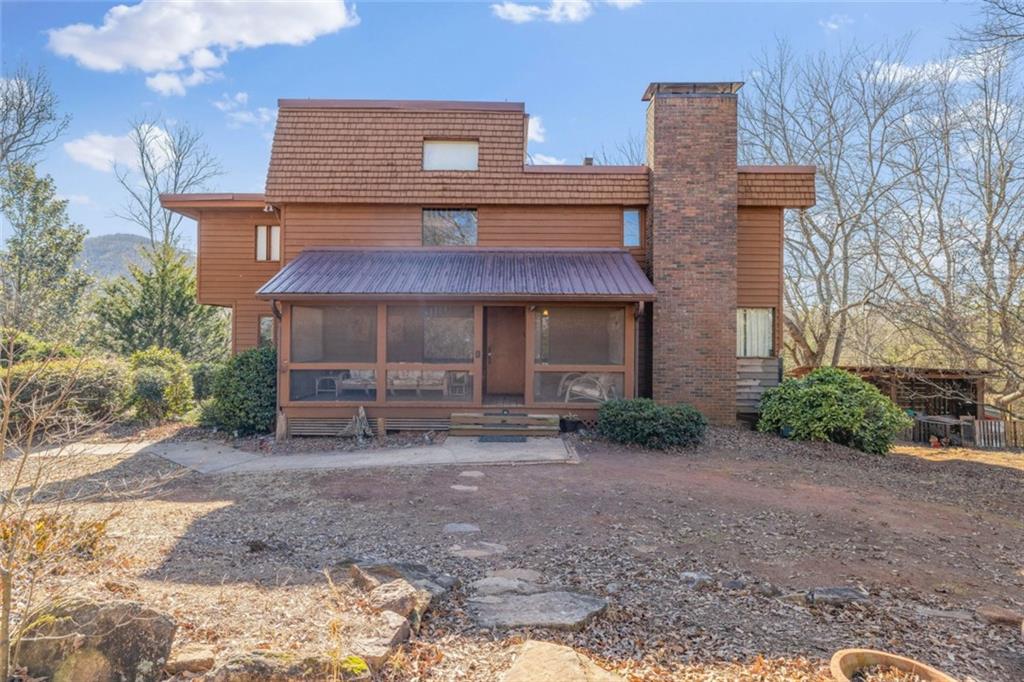 372 Loy Dorsey Road Cleveland, GA 30528 - Photo 1 of 1 a front view of a house with garden
