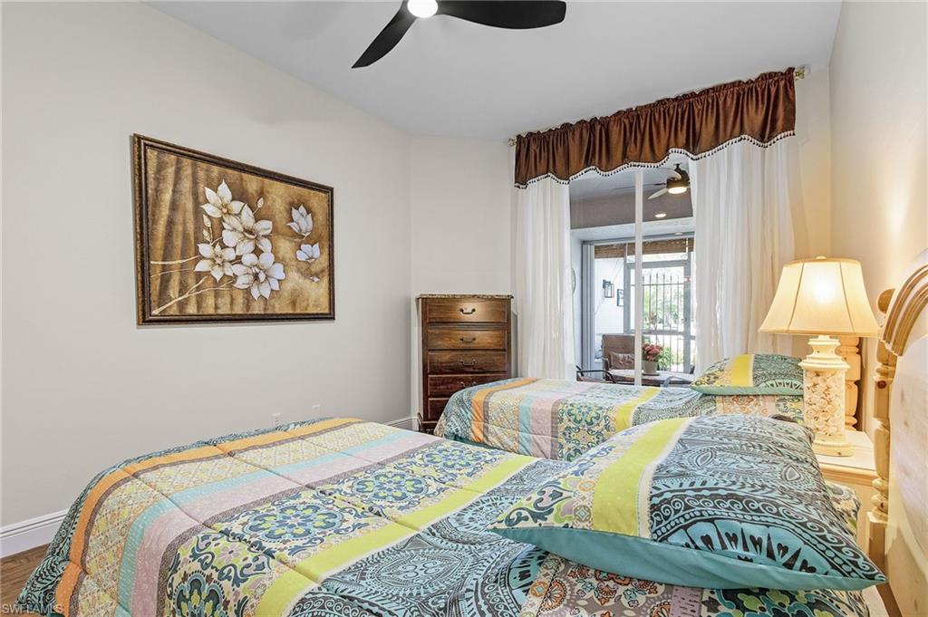 20681 Country Barn Drive Estero, FL 33928 - Photo 12 of 42 a bedroom with a bed and a flat screen tv