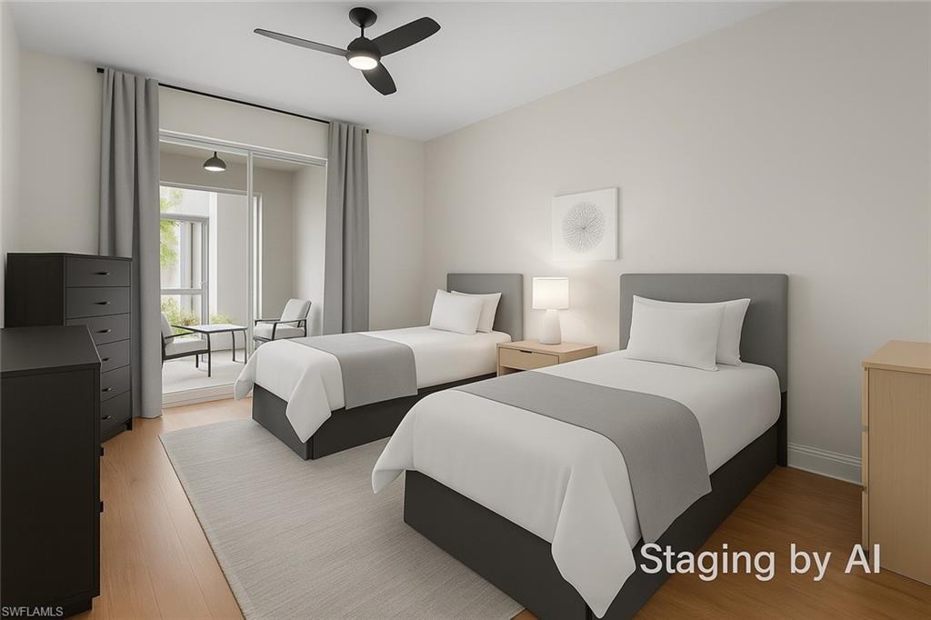 20681 Country Barn Drive Estero, FL 33928 - Photo 15 of 42 a bedroom with two bed and a night stand