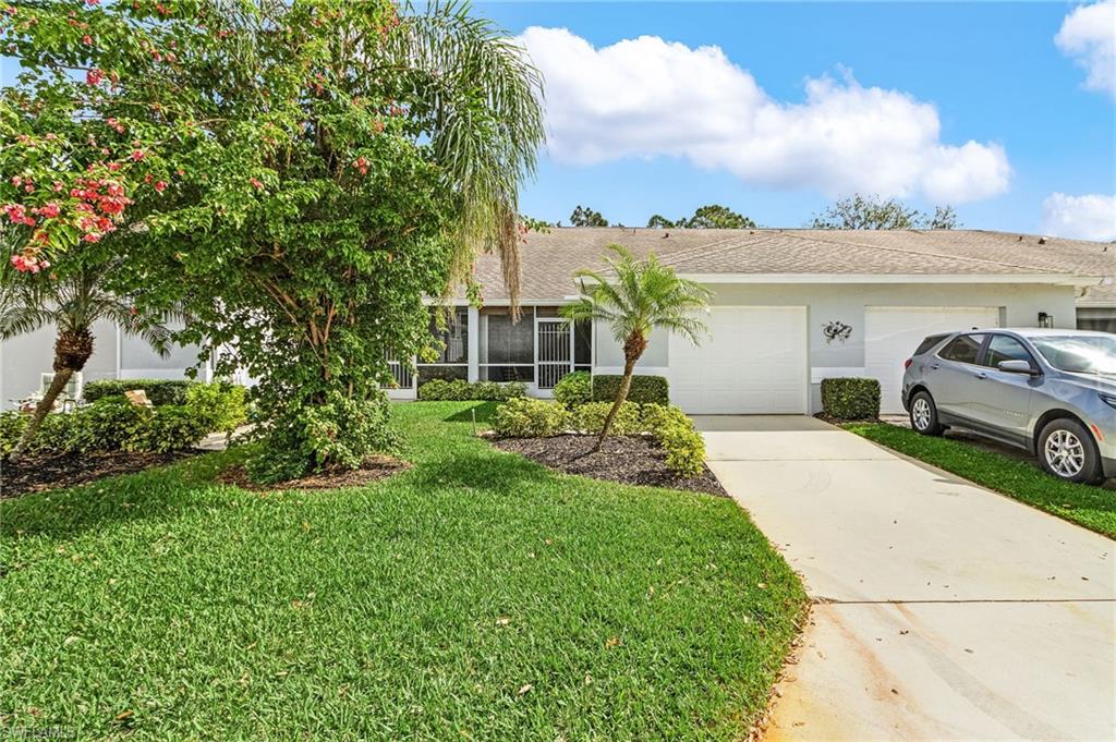 20681 Country Barn Drive Estero, FL 33928 - Photo 2 of 42 a house view with a garden space