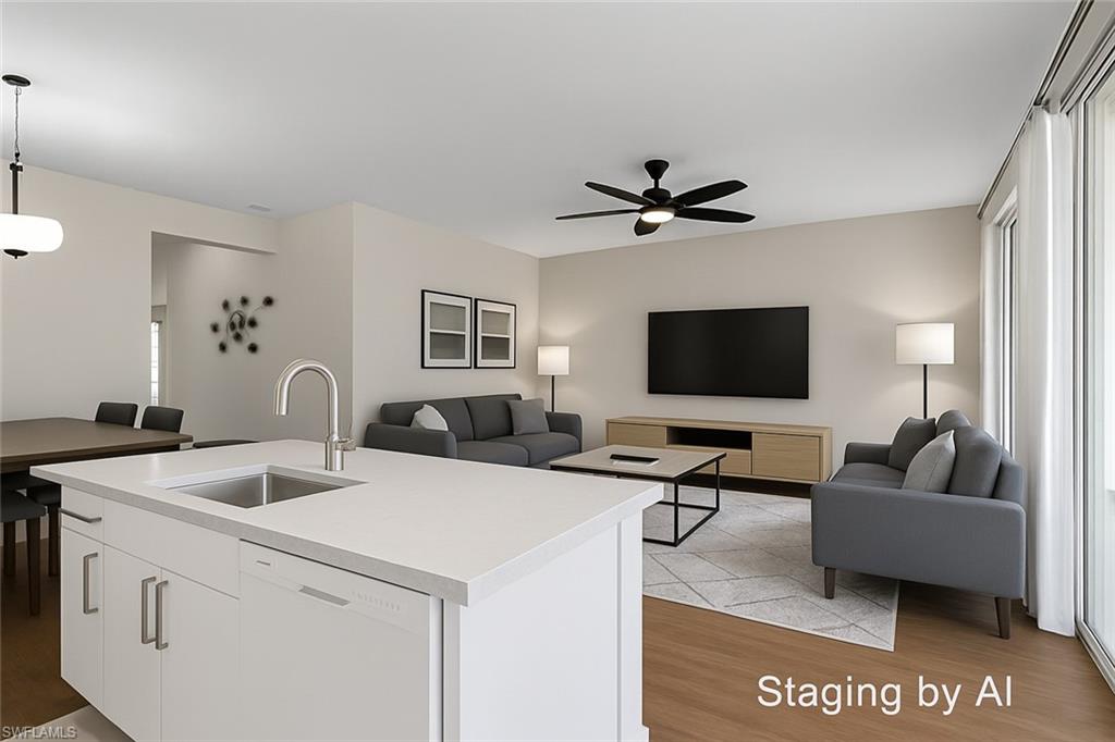 20681 Country Barn Drive Estero, FL 33928 - Photo 24 of 42 a living room with furniture and a flat screen tv