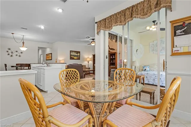 a dining room with furniture and window