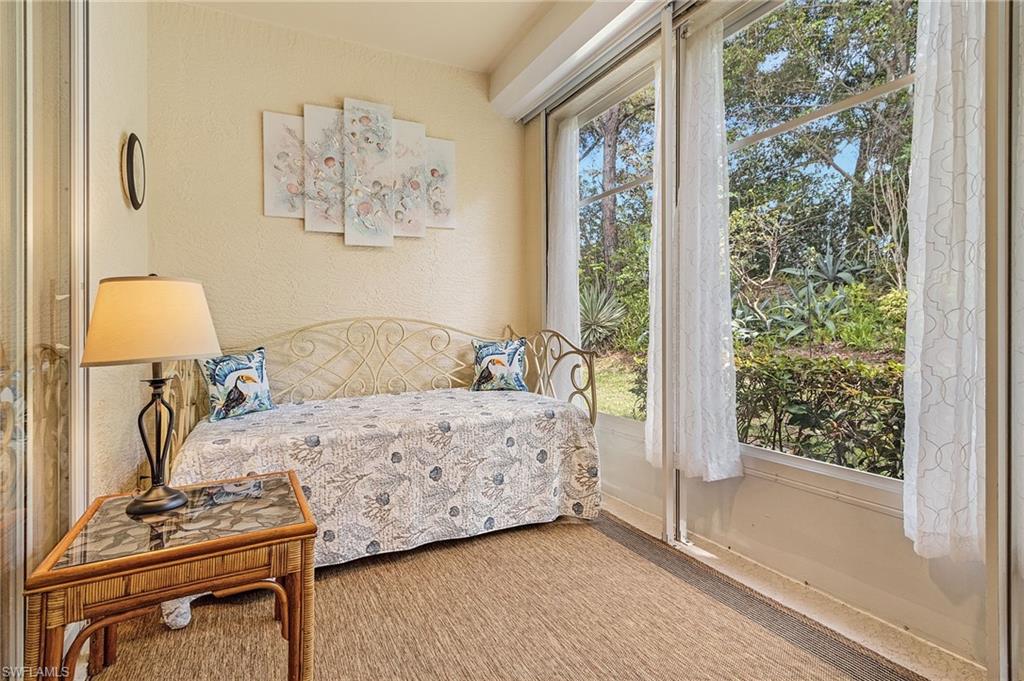 20681 Country Barn Drive Estero, FL 33928 - Photo 32 of 42 a bedroom with a bed and a window