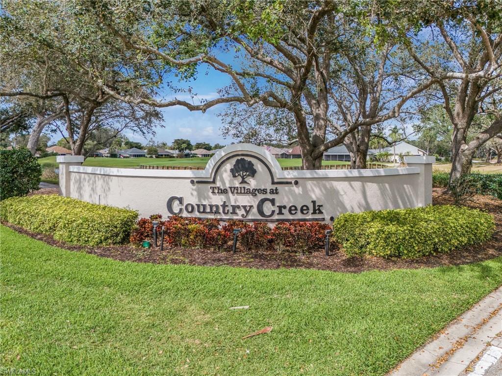 20681 Country Barn Drive Estero, FL 33928 - Photo 42 of 42 a front view of a house with garden
