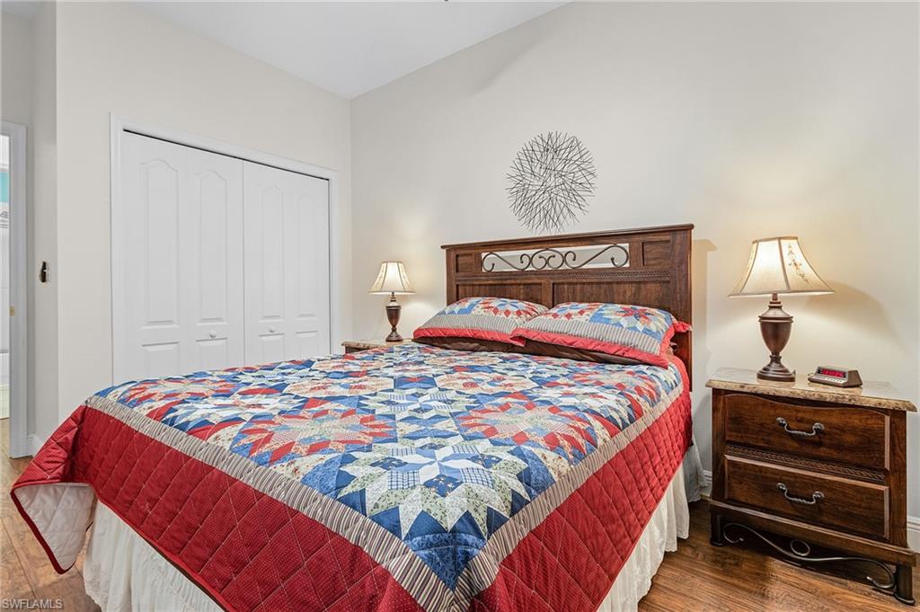20681 Country Barn Drive Estero, FL 33928 - Photo 8 of 42 a bedroom with a bed and a lamp on dresser