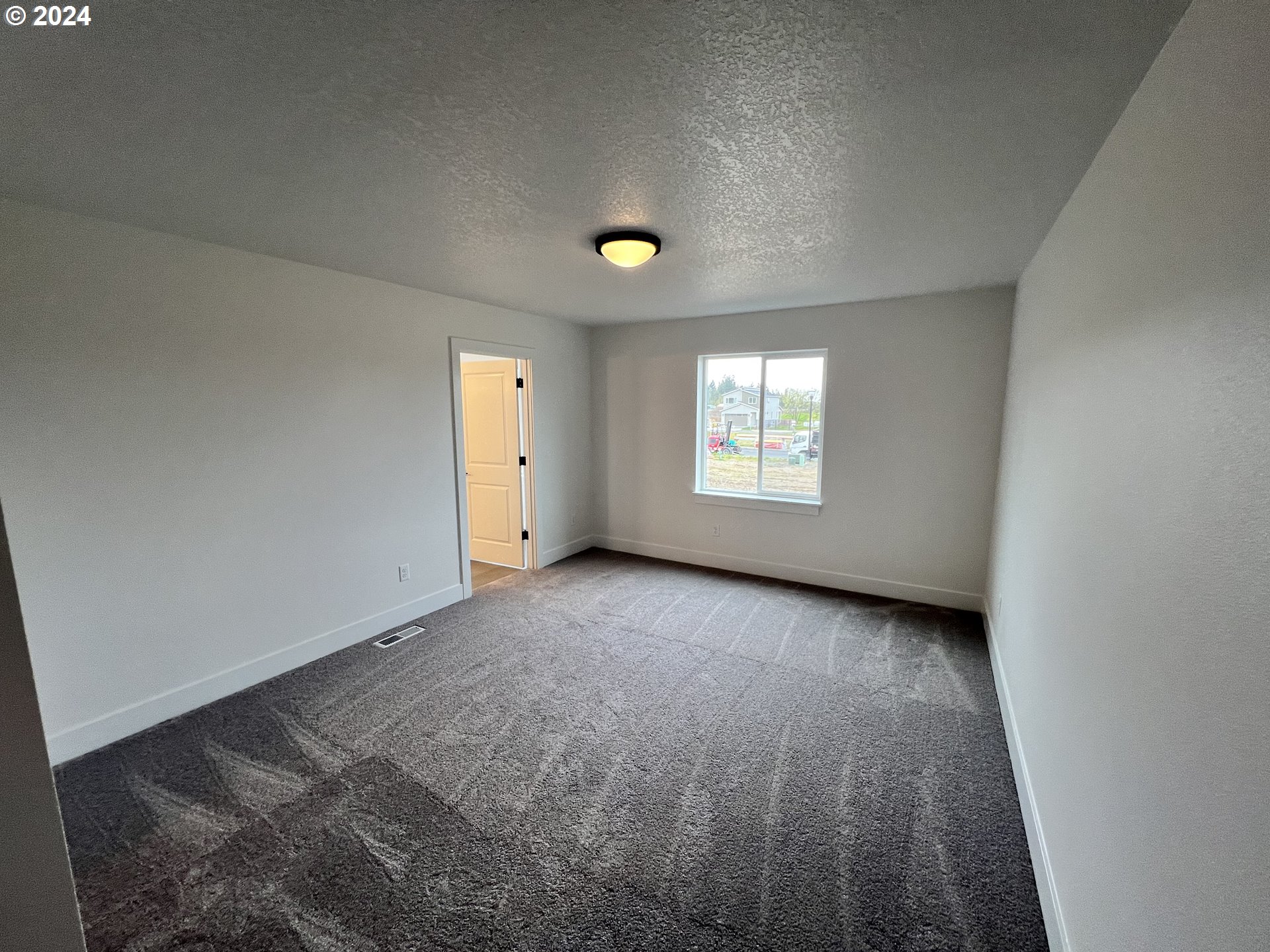 817 Northwest 175th Way Ridgefield, WA 98642 - Photo 15 of 20 a view of an empty room with a window