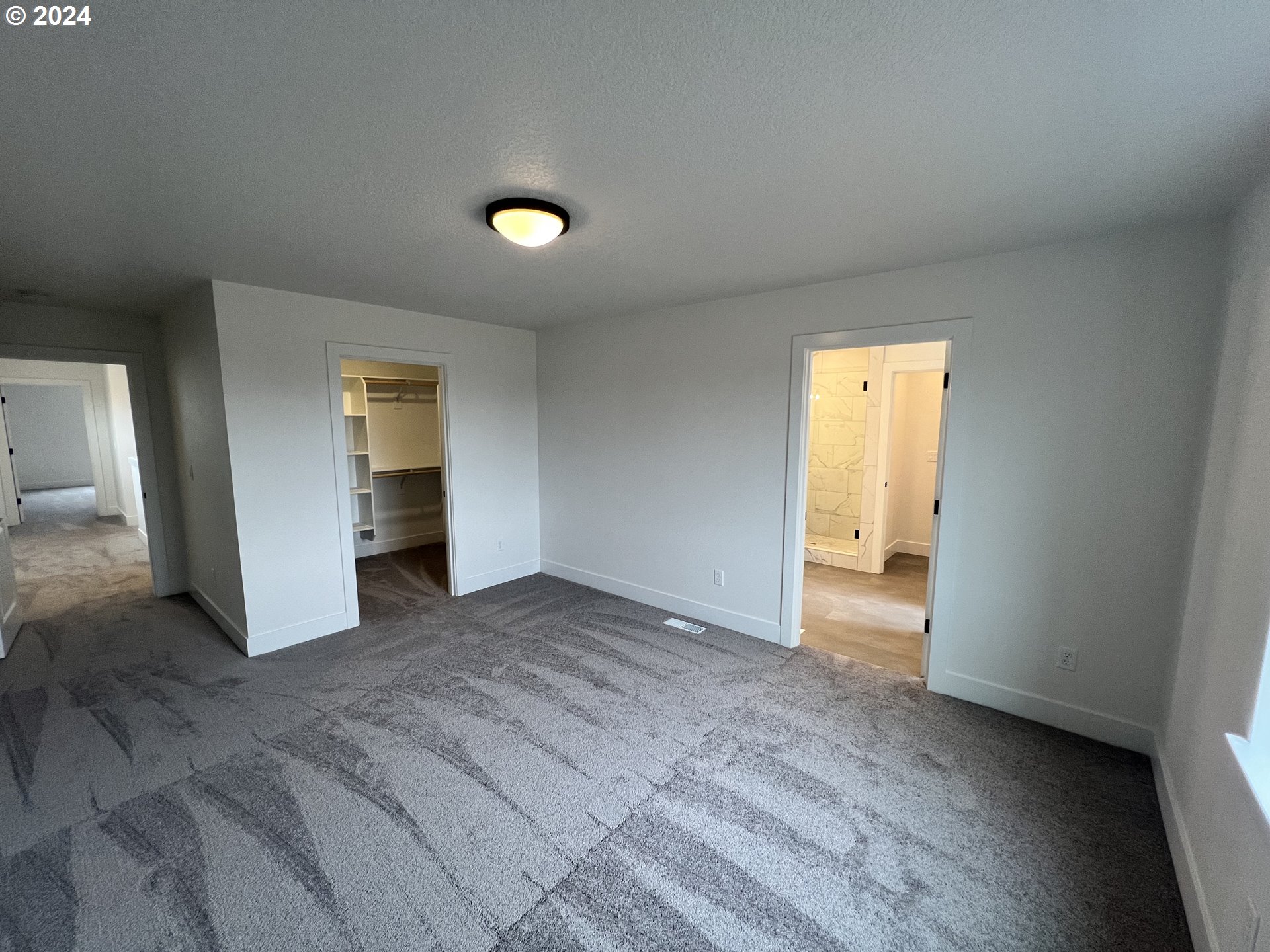 817 Northwest 175th Way Ridgefield, WA 98642 - Photo 16 of 20 an empty room with closet and a bathroom