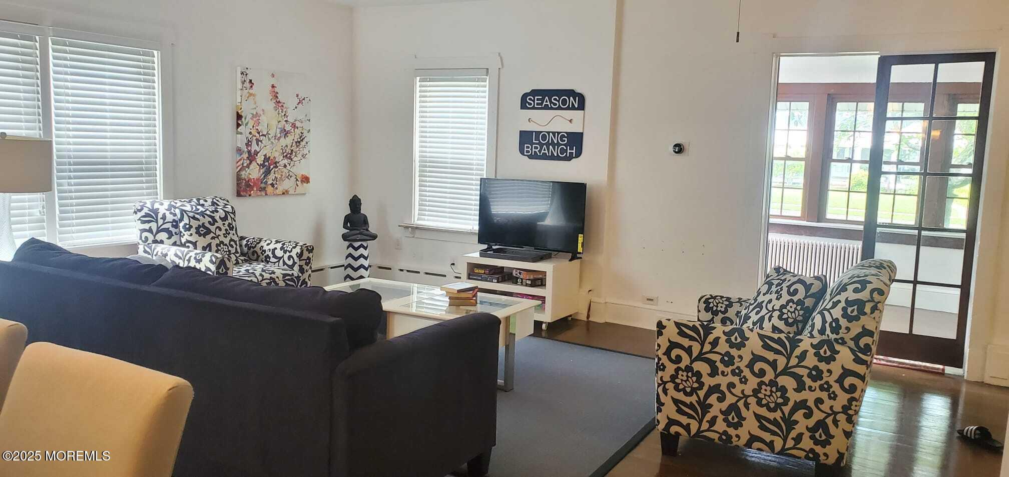 393 Bath Avenue Long Branch, NJ 07740 - Photo 5 of 22 a living room with furniture and wooden floor