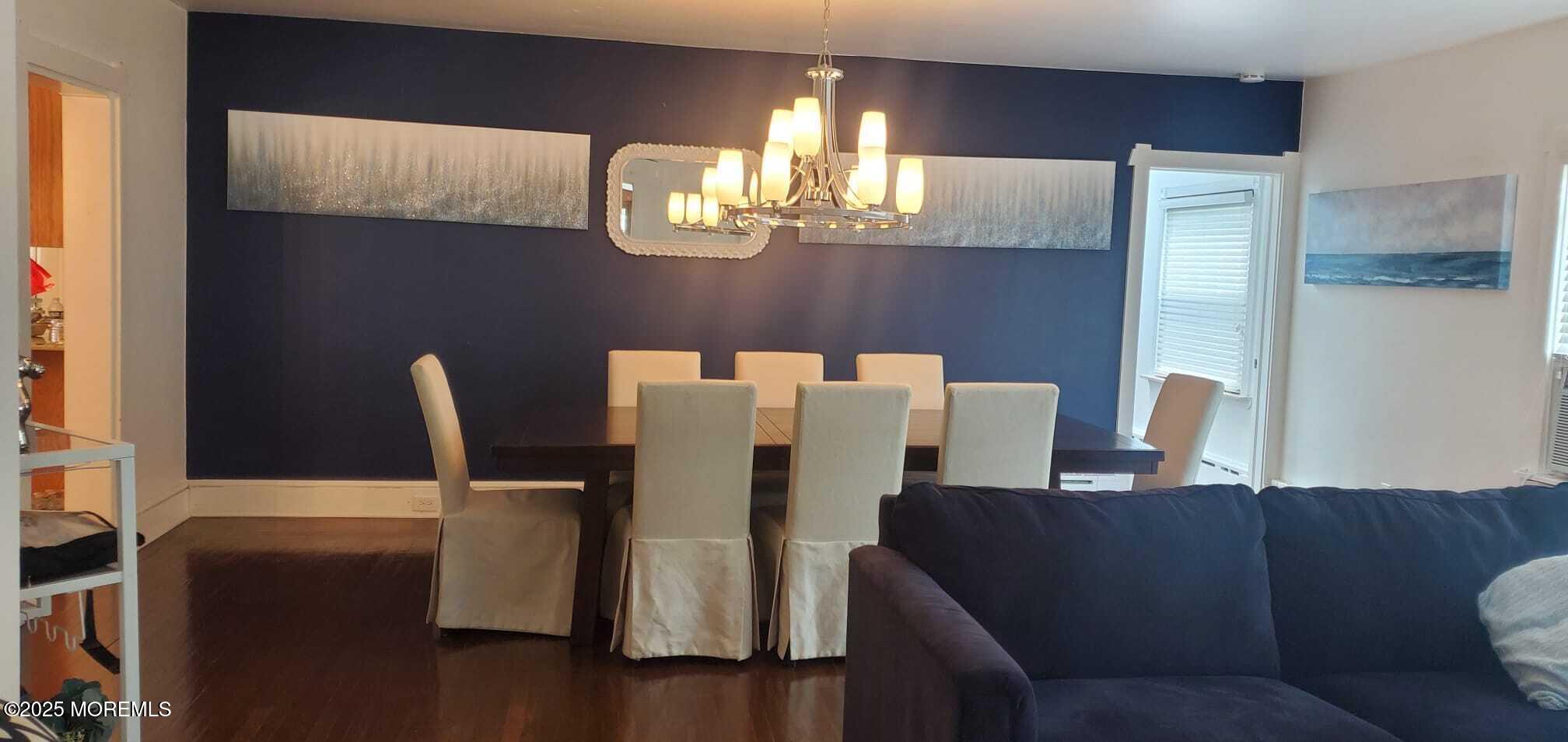 393 Bath Avenue Long Branch, NJ 07740 - Photo 6 of 22 a dining room with furniture and chandelier