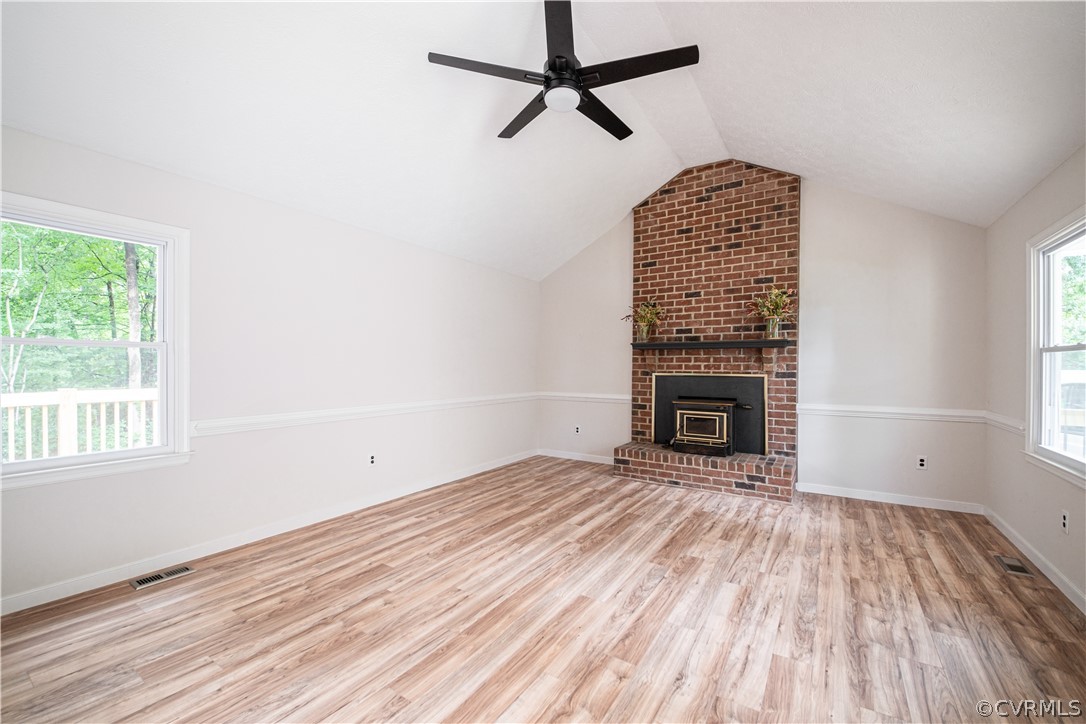 7507 Valencia Road Chesterfield, VA 23832 - Photo 8 of 41 a view of empty room with wooden floor and fireplace