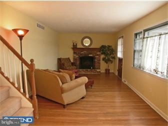 114 Midland Road Newtown, PA 18940 - Photo 2 of 12 a living room with furniture and a fireplace