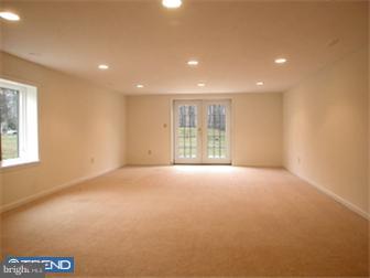 114 Midland Road Newtown, PA 18940 - Photo 5 of 12 a view of an empty room with a window