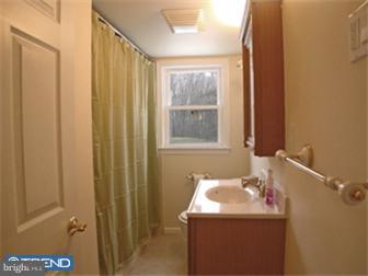 114 Midland Road Newtown, PA 18940 - Photo 8 of 12 a bathroom with a sink and a mirror