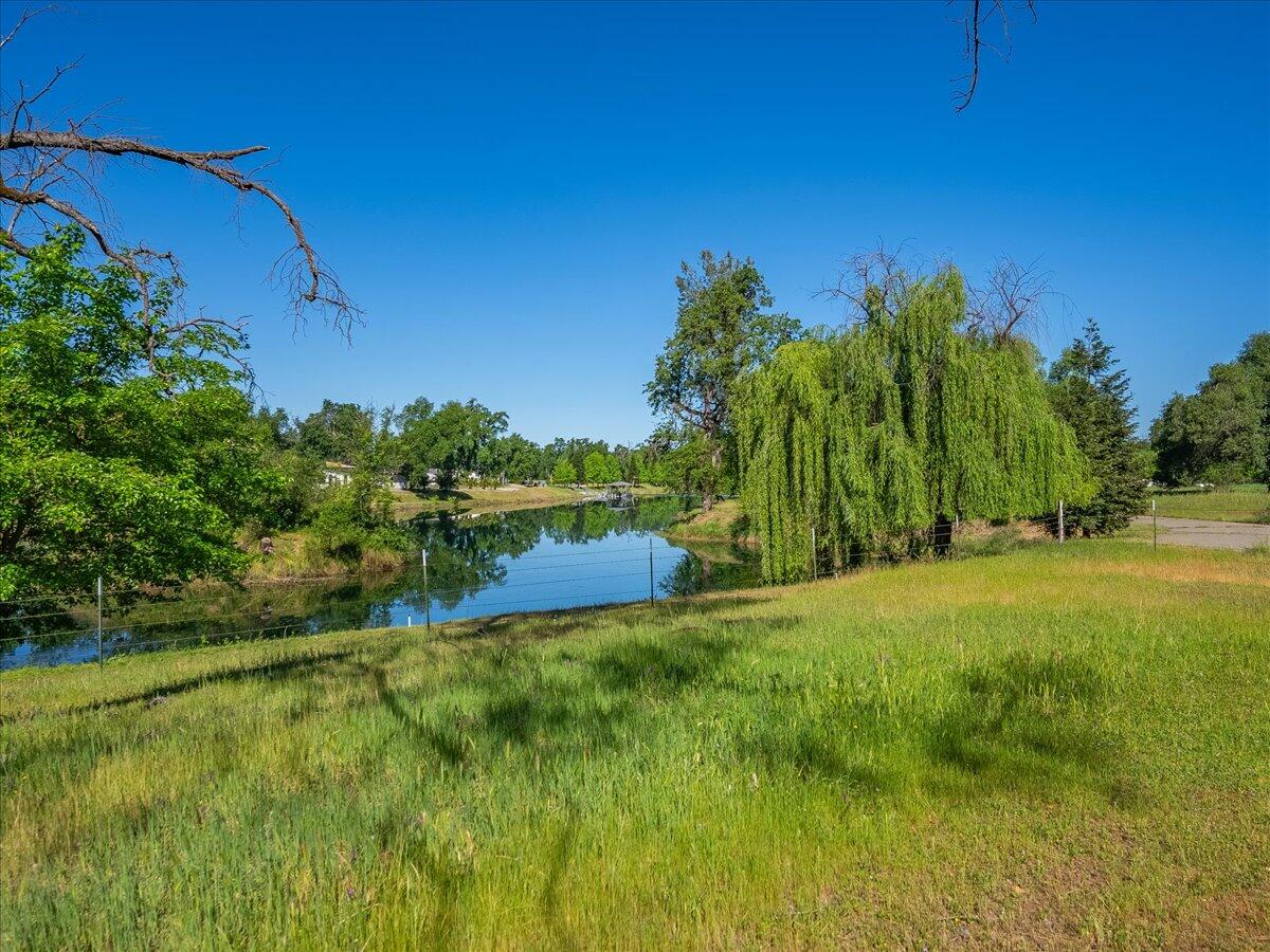 19301 Clover Road Redding, CA 96002 - Photo 14 of 18 a view of a field of grass and trees
