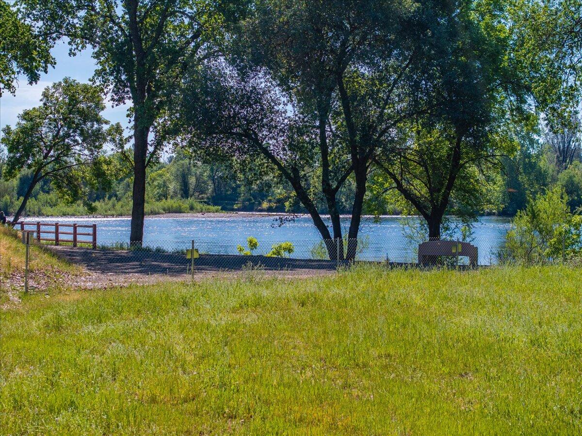 19301 Clover Road Redding, CA 96002 - Photo 6 of 18 a view of a swimming pool with an outdoor seating and a yard