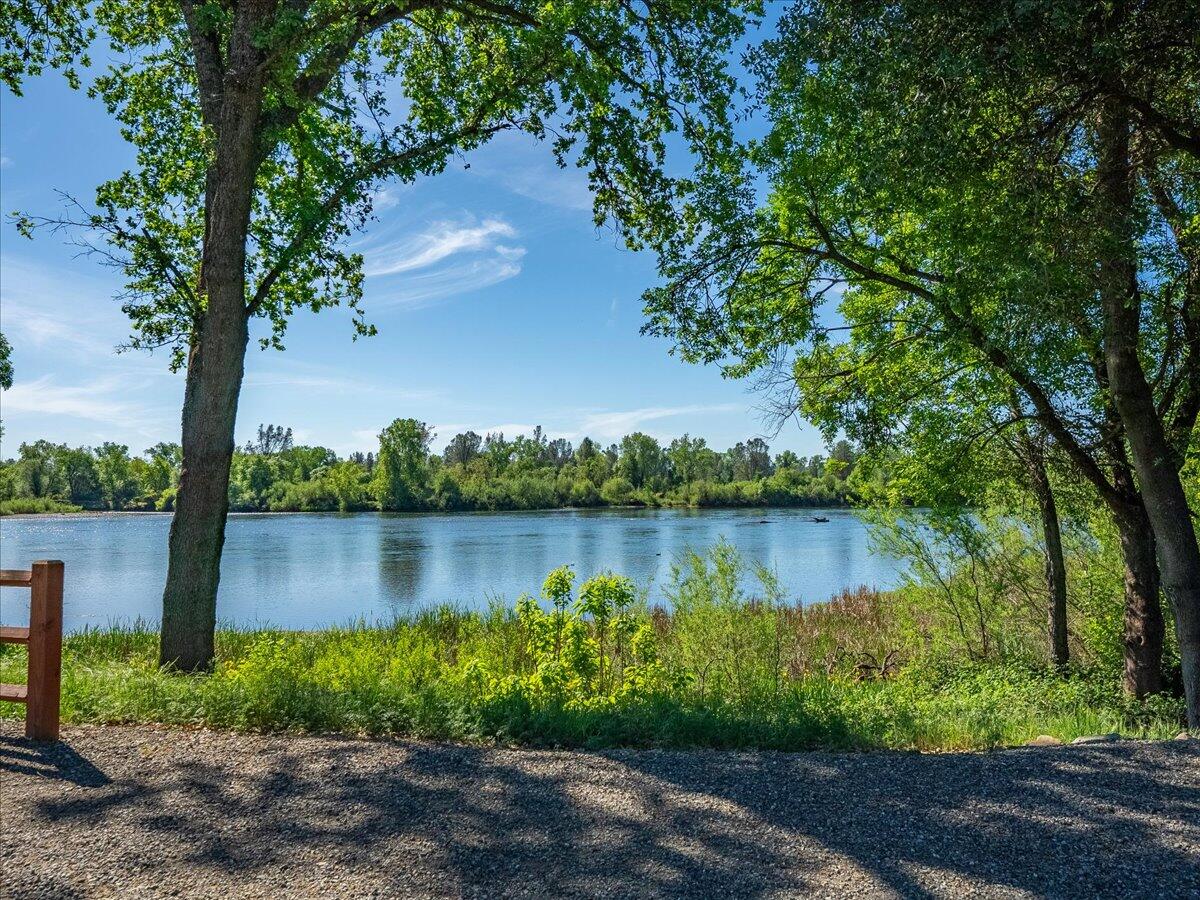 19301 Clover Road Redding, CA 96002 - Photo 9 of 18 a view of a lake next to a yard