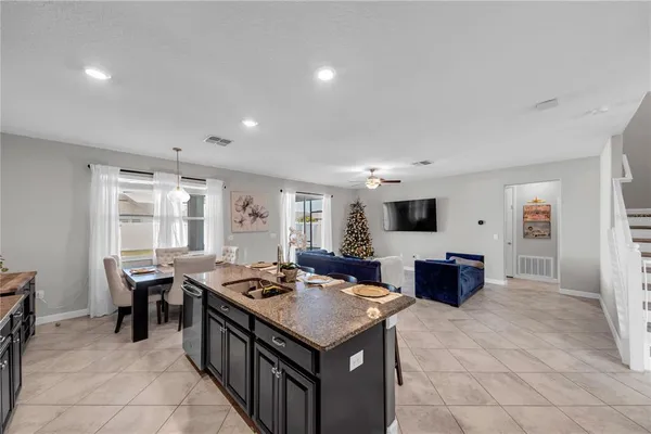 a kitchen that has a lot of cabinets in it