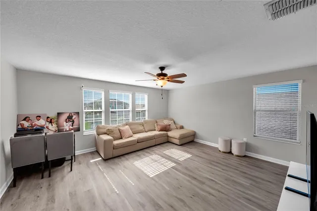 a living room with furniture and a large window