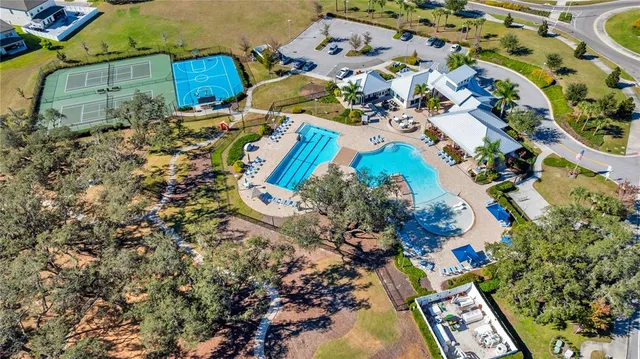 an aerial view of residential houses with outdoor space