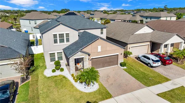 a aerial view of a house with a yard