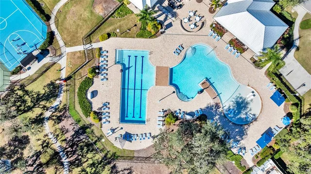 an aerial view of residential houses with outdoor space