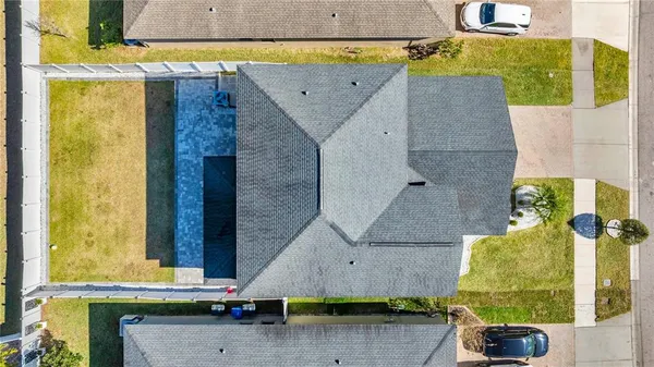 an aerial view of a house with swimming pool
